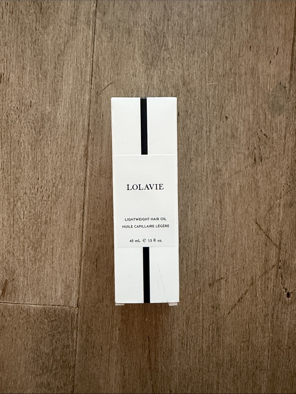 LOLAVIE Lightweight Hair Oil — White & Black Packaging